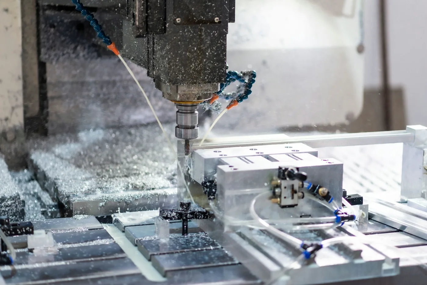 CNC milling machine cutting an aluminum workpiece